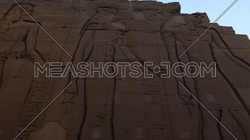 Low angel Tracking Shot for Writings on a wall at The Temple of Kom Ombo - Aswan, Egypt. by day