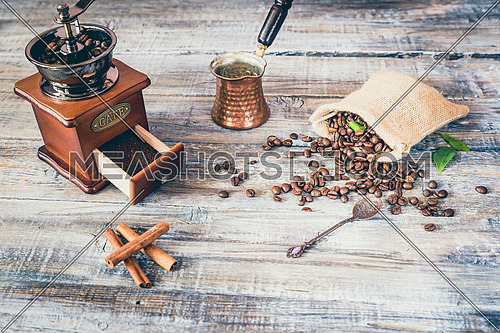 Still life coffee and coffee bean with coffee grinder on wooden board