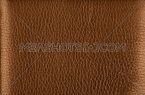 Close up background texture pattern of dark brown natural leather grain, directly above