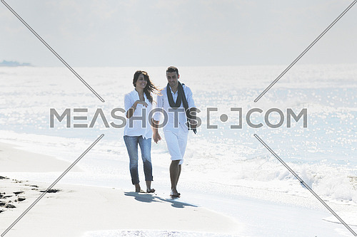 happy young couple in white clothing  have romantic recreation and   fun at beautiful beach on  vacations