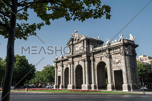 Madrid, Spain - August 4 2018:  Alcala Gate or Puerta de Alcala is a monument in the Plaza de la Independencia in Madrid, Spain