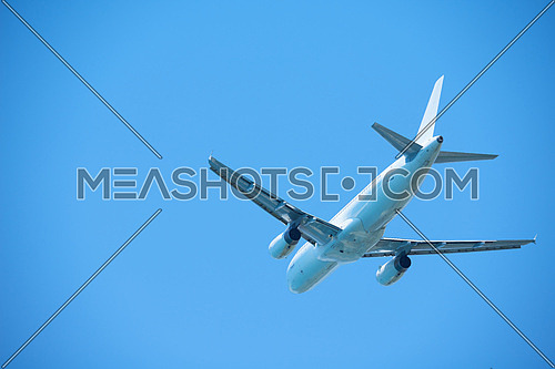 modern airplane travel,  clear blue sky in background