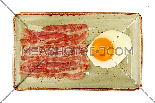 Close up English breakfast, sunny side egg and roasted bacon slices on blue plate isolated on white background, elevated top view, directly above
