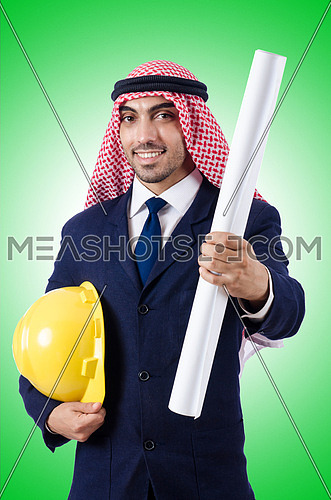 Arab engineer with drawings on white