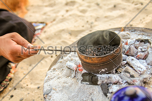 Roasting traditional Gabana Coffee in the desert