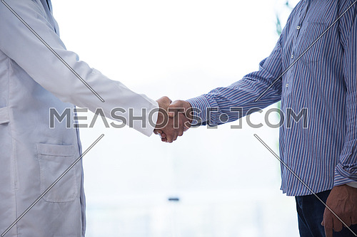 doctor and patient hand shaking