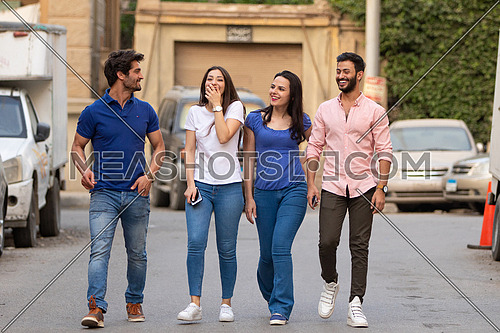 Group of young people walking in the street in korba area at day