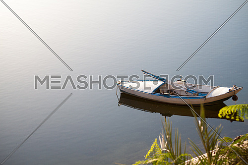 a wooden rowing boat in River Nile