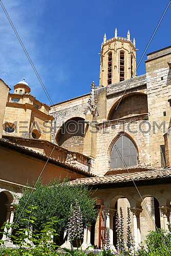 View of famous Aix Cathedral of the Holy Saviour (Saint-Sauveur) bell tower from The Cloister, Aix-en-Provence, Southern France