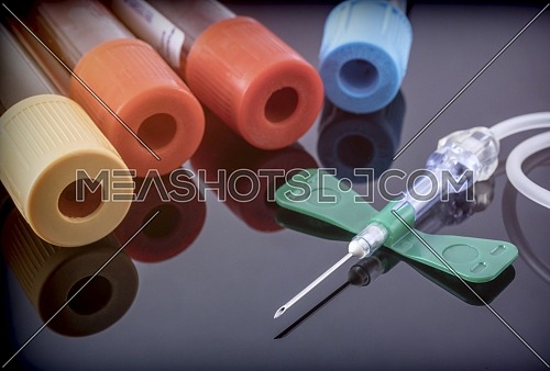 Several blood samples along with needle, conceptual image