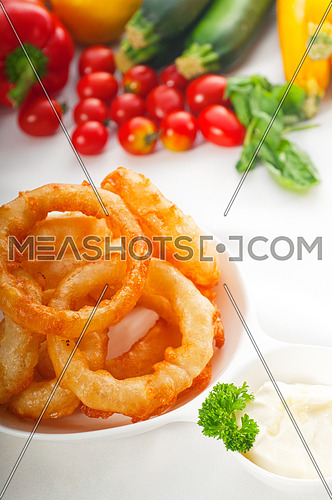 golden deep fried onion rings served with mayonnaise dip  and fresh vegetables oln background ,MORE DELICIOUS FOOD ON PORTFOLIO