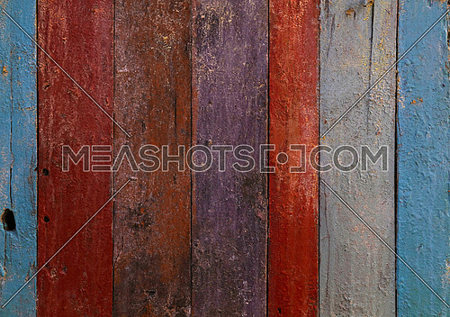 Multicolor old vintage grunge dirty painted colorful wooden planks background texture close up