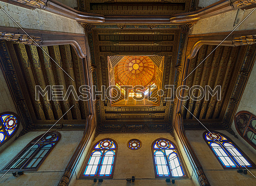 Wooden decorated dome mediating ornate ceiling with floral pattern decorations at Sultan al Ghuri Mausoleum, Cairo, Egypt