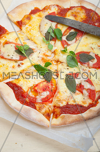Italian traditional pizza Margherita tomato mozzarella and basil