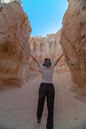 Female Tourist inside Makhroum Mountain in Sinai Trail at day