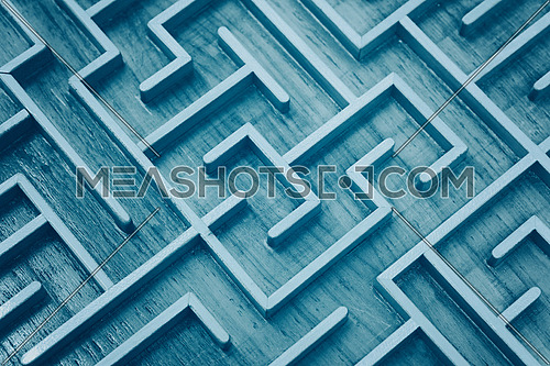 Close up of blue toned wooden labyrinth maze, toy puzzle game, elevated high angle view