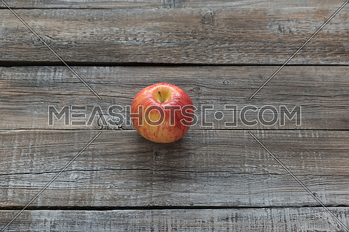 Orcanic red apple on wooden boards background. Autumn concept