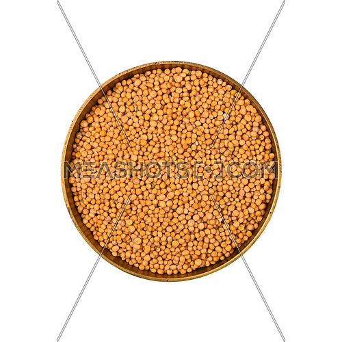 Close up one metal bowl full of wholegrain yellow mustard seeds, isolated on white background, elevated top view, directly above