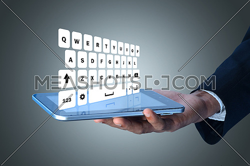 Man showing computer keys in color background