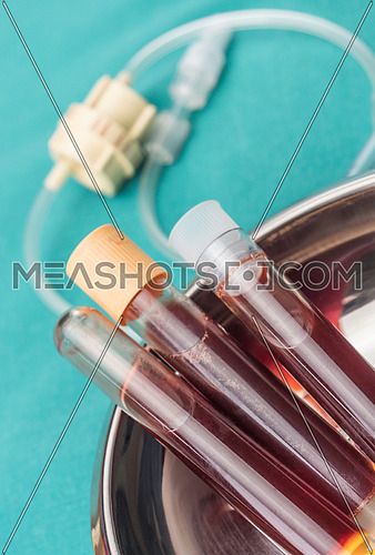 Blood samples in tubes at a hospital table, conceptual image