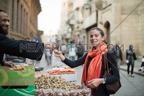 Young middle eastern woman in the traditional street market