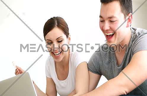 couple buying things for their home online