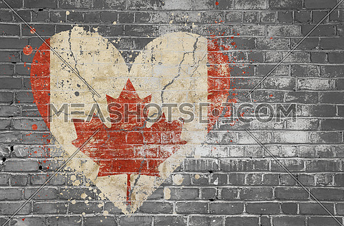 Grunge distressed heqart shaped flag of Canada painted on old weathered grey brick wall