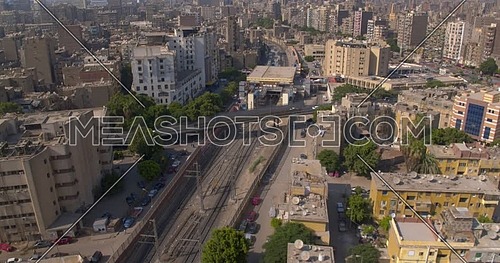 Reveal Shot from Drone for Cairo while Metro is passing by at day