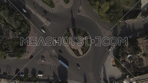 Aerial Bird-Eye shot flying over Cairo Downtown empty streets showing Cairo Opera House and Saad Zaghloul Statue during the corona pandemic lockdown by day 10 April 2020