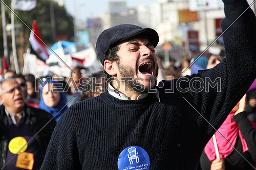 a man chanting in a protest march