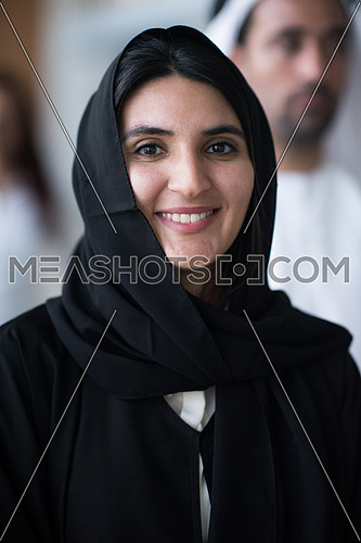 a woman wearing tradition arabian abaya smiling