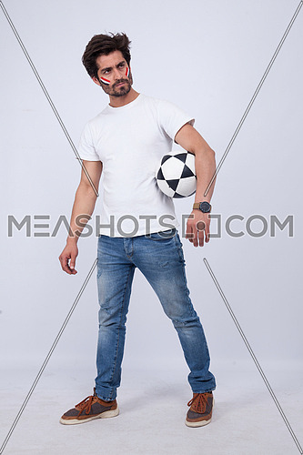 a  young man with a white t-shirt holding football on a white background