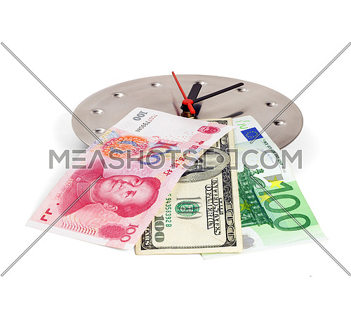 currency bills on a stainless steel clock clock isolated on white back ground