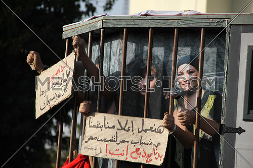 a symbolic prison  mockup during a protest