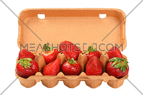 Strawberry in open brown egg carrier over white