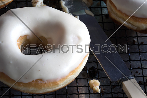 Donuts with nuts and knife beside it
