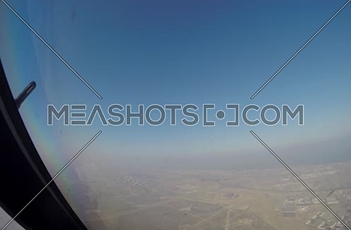 inside cockpit shot  flying over the desert at day