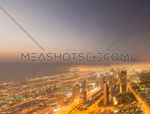 Panorama of night Dubai during sunset