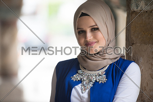 Portrait Of Young Muslim Woman Wearing Scarf While Thinking Outdoor