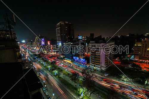 Long shot for traffic in Gameat Al Dowal Street at Cairo at Night