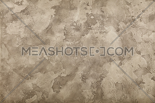 Grunge pastel grey and brown faded uneven old aged daub plaster wall texture background with stains and paint strokes, close up