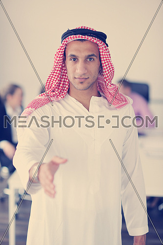Business meeting - Handsome young Arabic  man presenting his ideas to colleagues and listening for ideas for success investments at bright modern office room