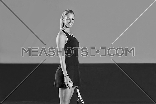 Female Tennis Player With Racket Ready To Hit A Tennis Ball