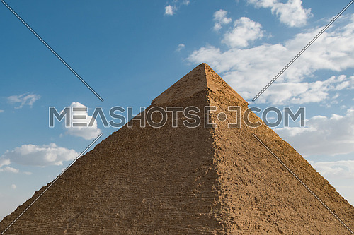 One of the great pyramids of giza Egypt with sky and clouds