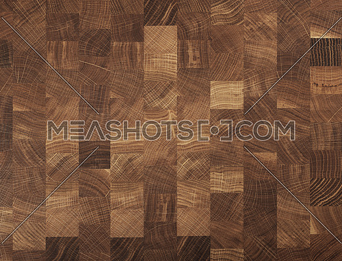 Brown oak wooden butcher chopping block, natural durable end grain hard wood cutting board texture background pattern, close up