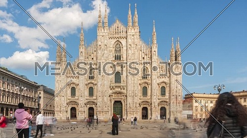 Milan, Italy - May 03, 2021: Crowd of tourists in the square in front of the Duomo of Milan,sunny day time lapse,Italy.