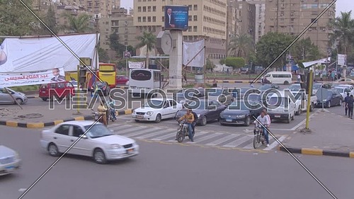 Fly Over top shot for Traffic in Moustafa Mahmoud Square in 22th of March 2018 in Giza  at day.