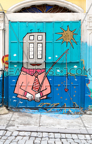 Closed shop exterior with roller door covered with colorful graffiti near Istiklal Street, Istanbul, Turkey