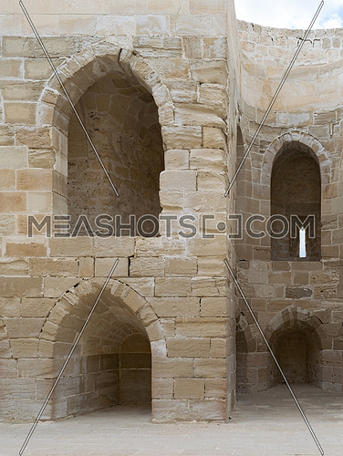 Ruins of olld wall with arched cavities at the citadel of Alexandria, Egypt