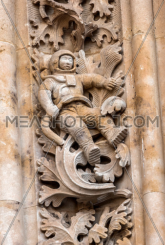 Salamanca, EspaÃ±a: August 18, 2019: detail of figure of astronaut worked in stone in door of Branches (north), opposite to the Palace of Anaya, realized by sculptor Miguel Romero Con motivo de to receive Salamanca the exhibition The Ages of the Man in 1993